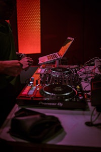 a dj is mixing music in a room