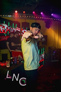 a man is standing in front of a stage