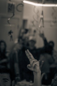 a black and white photo of a group of people at a party